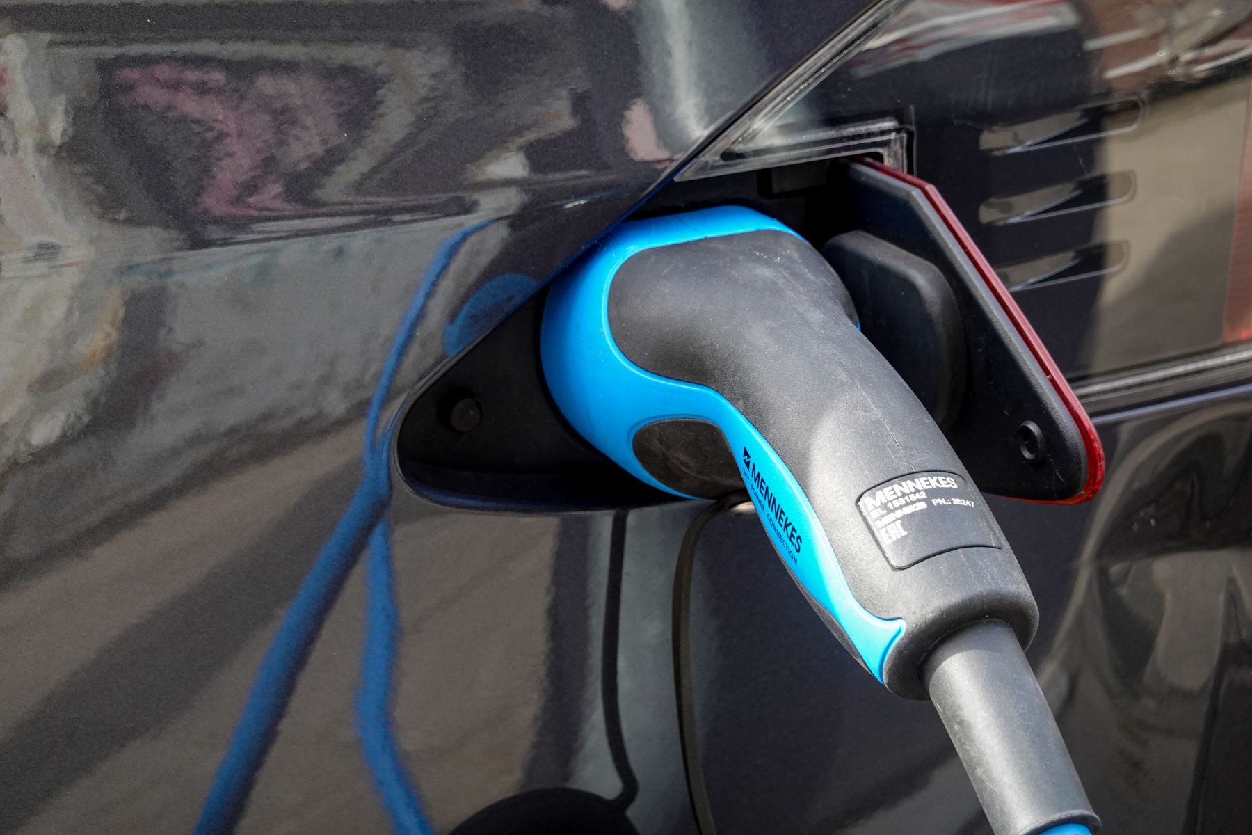 Electric vehicles charging at a sunny Southern California charging station